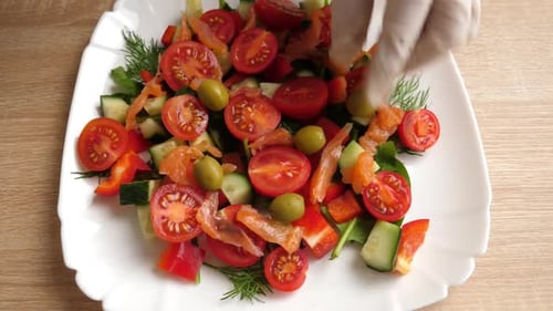 Close Up of Salad on Plate Being Prepared