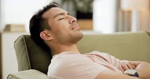 Man Relaxing on Couch, Close-Up