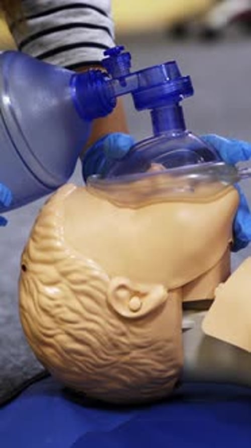 Medical Professional Using a Bag Valve Mask on Mannequin