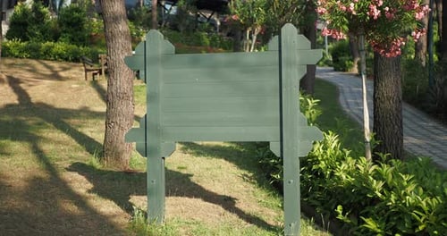 Wooden Sign in the a Park with Copy Space Concept
