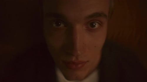 Close Up of Young Man Looking at Camera