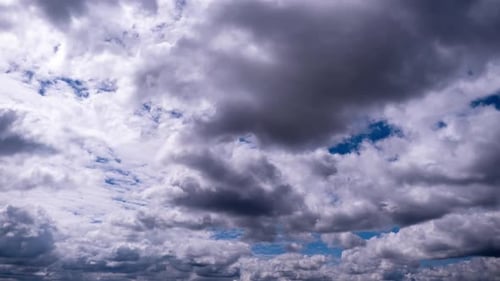 White Clouds Moving Across a Blue Sky
