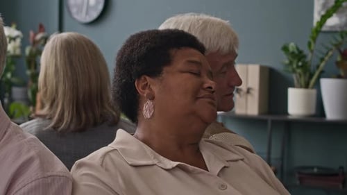 Group of Adults Seated Together Indoors