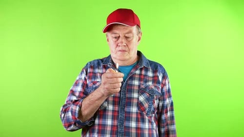 Man Flicking Lighter With Flame on Green Screen