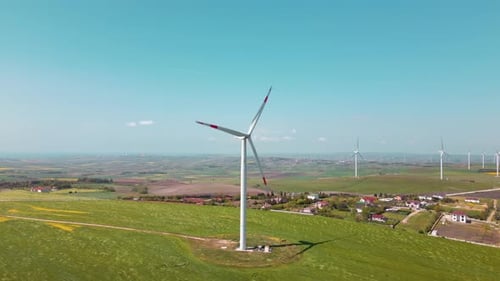 Wind Turbines Spinning in Rural Field