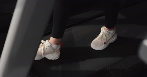 Female Foot Going on the Treadmill