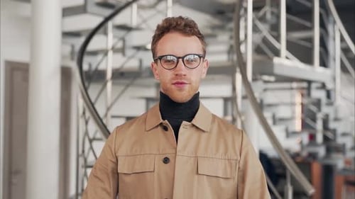 Young Adult Smiling Confidently in Modern Office