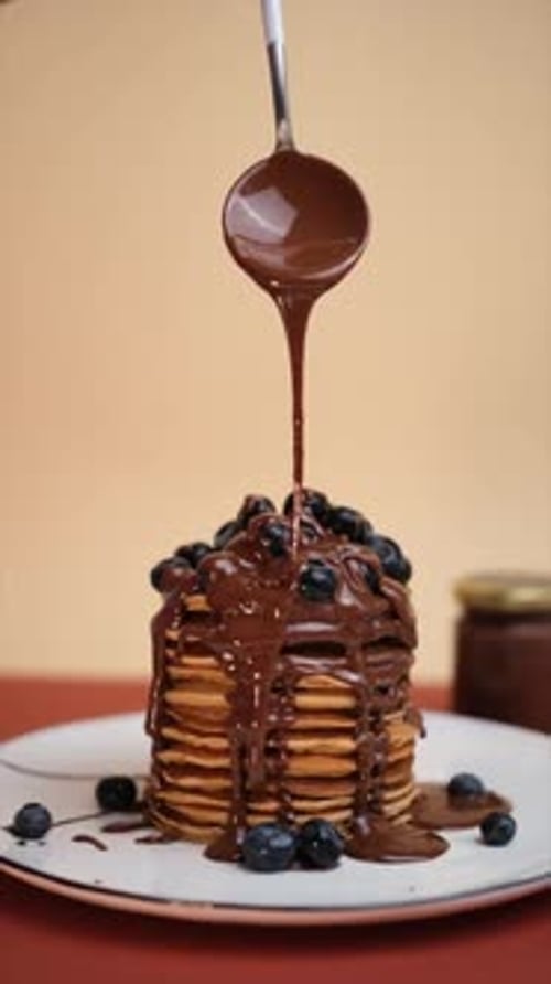 Decadent Chocolate Syrup Poured Onto Pancake Stack