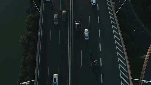 Aerial View of Highway and Overpass with Cars and Trucks at Sunset A Modern Flyover Road Junction in
