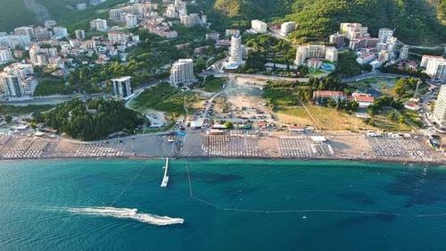 Bird's Eye View of Towns of Budva and Becici with Hotels and Beaches Near Adriatic Sea Against the