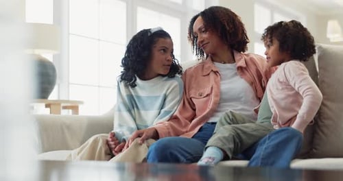 Mother and Daughters Relaxing Together at Home