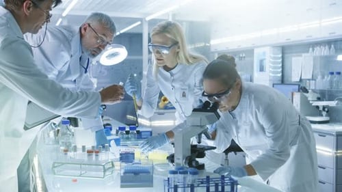 Team of scientists working in a modern lab