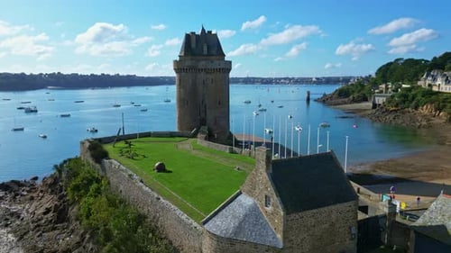 Solidor Tower, Saint-Malo, Brittany in France. Aerial drone orbiting backward