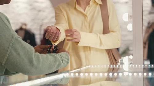 Woman Trying on Fancy Bracelet in Luxury Boutique