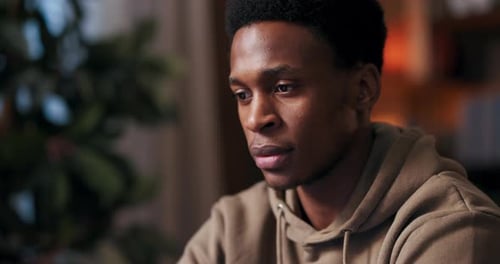 Young Man in Hoodie Indoors