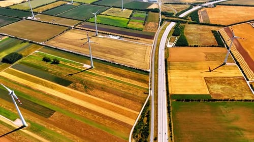 Aerial View of Wind Turbines and Farmland