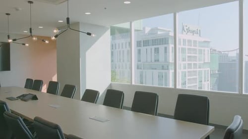 Panning Shot Of A Modern Conference Room With A City And Building View