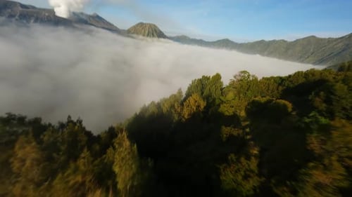 Aerial View of Fog-Shrouded Mountainous Landscape