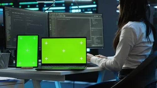 Engineers in Data Center Monitoring Security Threats Using Chroma Key Devices