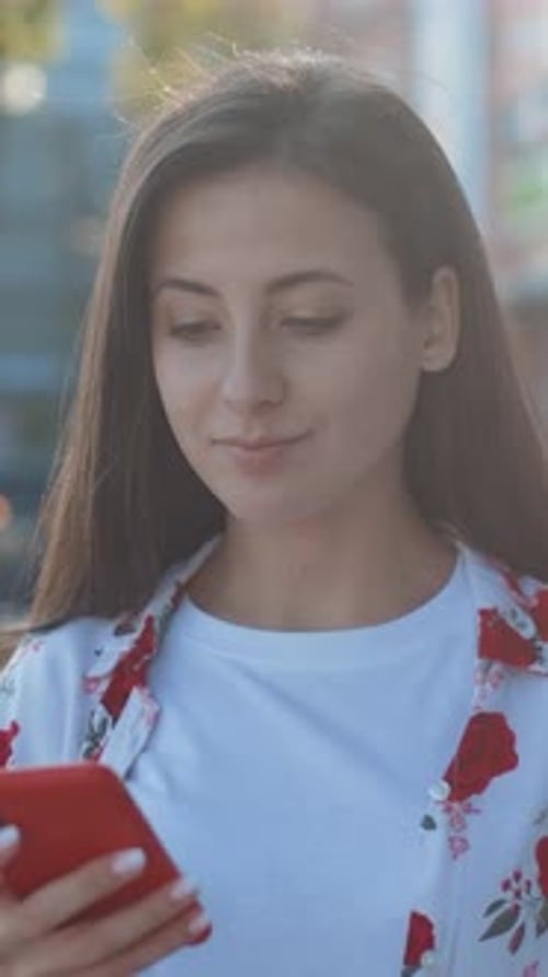 Smiling Young Adult Woman with Mobile Phone