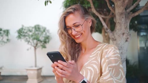 Portrait Happy Attractive Woman Using Smartphone at Street