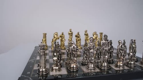 Antique Gold and Silver Chess Set on Board