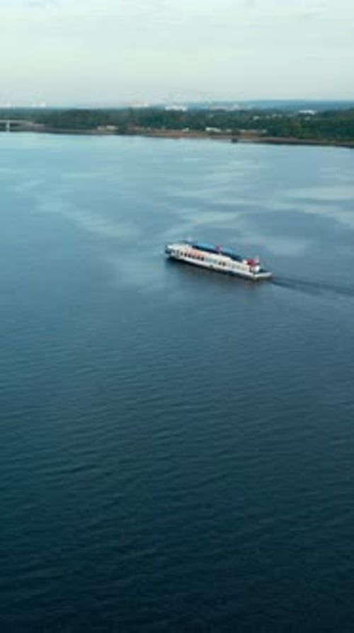 Passenger Ferry Navigating Calm River Waters Near City Clip