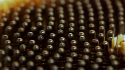 Pharmaceutical factory production line macro view of medical ampoules and vials