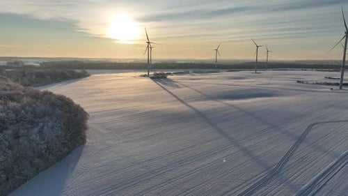 Aerial footage of wind farm in winter.
