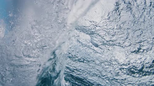 Ocean wave breaks on the shore in the Maldives