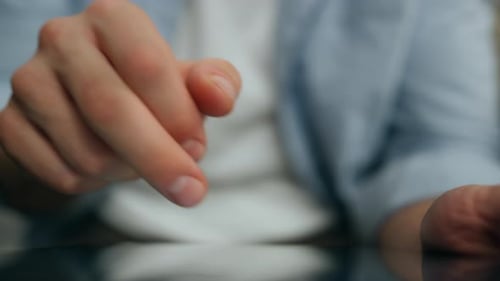 Man Fingers Typing Tablet Screen Indoors Close Up. Unknown Blue Shirt Guy Texting Tab Computer Me...