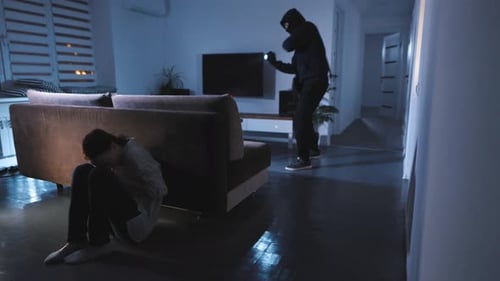 Frightened Woman with Burglar in Dark Home