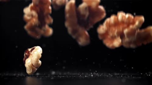 Walnuts Falling and Bouncing in Slow Motion