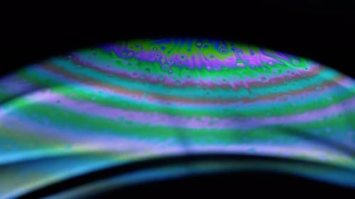 4k stable shots of soap balloons showing the colors of the macro world through a microscope perspect