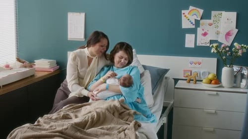 Mature Woman Visiting Daughter in Maternity Hospital