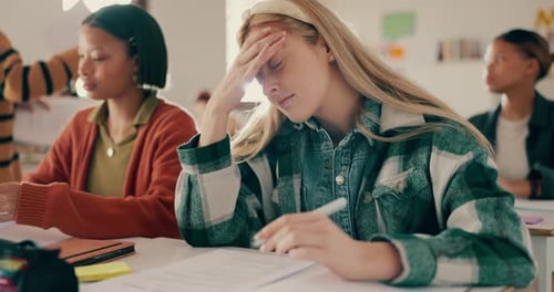 Headache, student and anxiety for test in classroom with stress for assessment