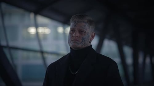 Stylish Man Standing in Urban Location