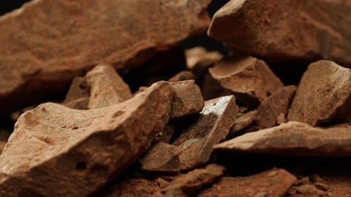 Close-Up of Chocolate Chunks Piled Together on Black