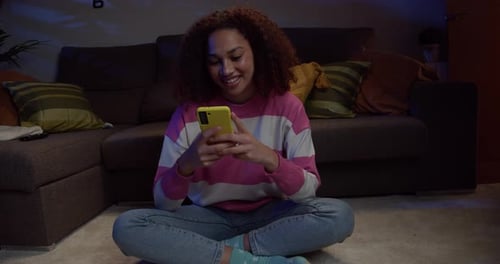 Woman Using Phone at Home, Sitting Cross-legged