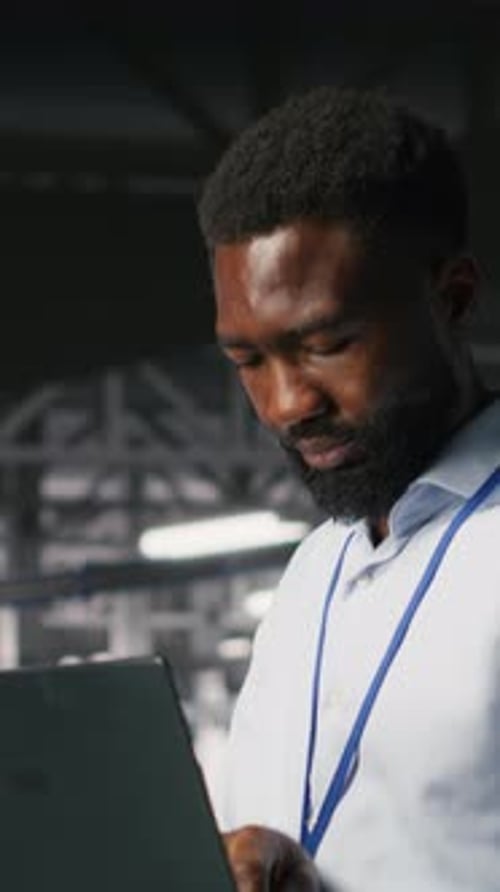 Vertical Video Happy Technician and Colleague in Data Center Reviewing AI LLM Visualizations