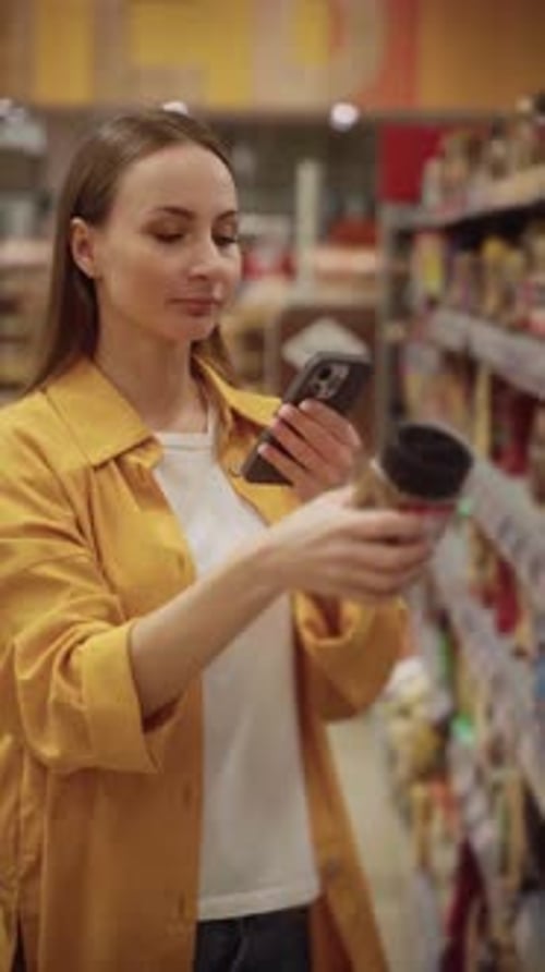 Woman Scans Coffee in Store As She Explores a Wide Selection of Beverages During Shopping