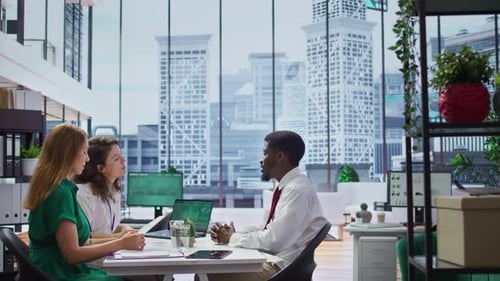 Business Team Discussing Strategy in Modern Office