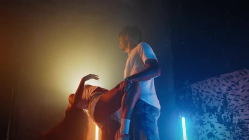Attractive Young Woman Dancing Sensual Dance with Her Boyfriend in Studio Beautiful Mixed Race Lady