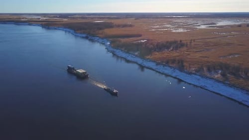 Aerial View of Shipping Barge Transporting Goods Up the Mississippi River on the Missouri and
