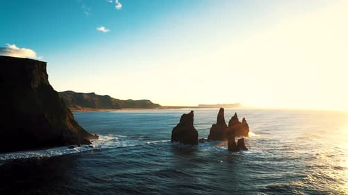 aerial drone shot of dramatic Black sand beach coastline in Iceland