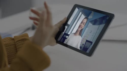 Smiling Woman Enjoy Videochat By Tablet with Colleague Online at Office Closeup