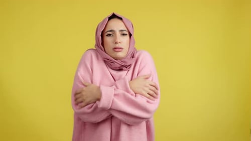 Muslim Woman Looking at Camera in the Cold