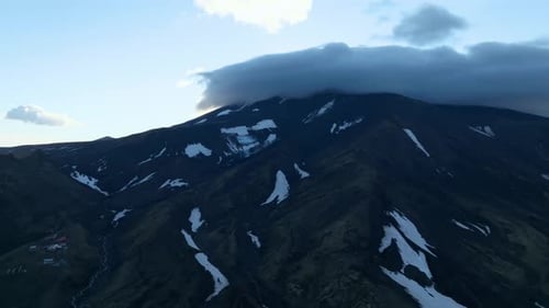 Aerial view of Avachinsky Volcano slopes with snow patches, Kamchatka