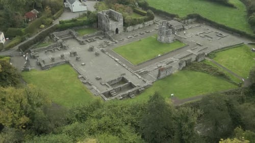 Mellifont abbey ruins surrounded by green landscape near drogheda, ireland, aerial view
