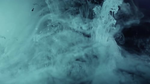 Light Blue and Dark Ink Mixing Together